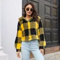 Close-up of yellow and black checkered fleece jacket featuring trendy balloon sleeves - S / Tops / Turmeric