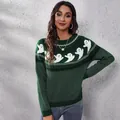 Close-up of the knit pattern on a green Halloween sweater featuring white ghosts and dots - S / Tops / Green