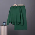 Detailed view of women's dark green two-piece knit set featuring oversized sweater and skirt - One Size / Top And Bottom / Green