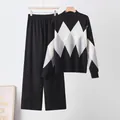 Close-up view of a stylish argyle pattern knit sweater and wide-leg trousers set. - One Size / Top And Bottom / Black