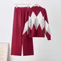 Detail view of the red argyle knit sweater and matching wide-leg trousers set. - One Size / Top And Bottom / Red