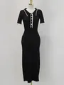 Detailed view of the ribbed knit fabric and contrast collar on a black long dress - S / Dresses / Black
