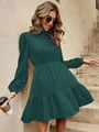 Close-up of the pleated fabric texture and puff sleeve detail on green dress - S / Dresses / Malachite green