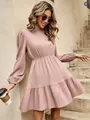 Model wearing a pleated dusty rose long sleeve dress with a high neck and ruffled hem - S / Dresses / Yellow