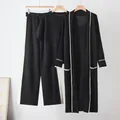 Detail of women's black 3-piece knit set with white contrast trim and long cardigan. - One Size / Set / Black
