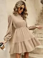 Detail of an elegant tan mock neck pleated mini dress with lantern sleeves and a ruffled hem - S / Dresses / Khaki