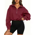 Detail view of a maroon half-zip cropped sweatshirt with a collar and adjustable drawstring - S / Tops / Red