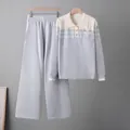 Light blue and white striped knitwear set with sweater and wide-leg pants on hangers - One Size / Top And Bottom (6635) / Gray