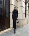 Elegant long-sleeved black ribbed knit maxi dress featuring a chic high neck design - S / Dresses / Black