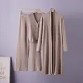 Detail of beige ribbed three-piece knit set including cardigan, vest, and wide-leg pants. - One Size / Top And Bottom / Khaki
