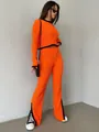 Stijlvolle oranje geribbelde gebreide tweedelige set voor dames met zwart detail. - Eén maat / Boven- En Onderstuk / Oranje