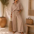 Detail view of a stylish two-piece striped vacation set with shirt and wide-leg pants - S / Top And Bottom / Khaki