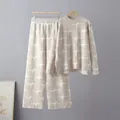 Detailed view of women's knitted two-piece set with starburst jacquard pattern. - One Size / Top And Bottom / Apricot