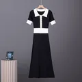 Front view of a French vintage contrast polo collar short sleeve knitted midi dress - S / Dresses / Black