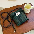 Small dark green plaid wool crossbody bag with rope strap and colorful logo label. - Dark Green