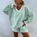Detail view of a green and white striped two-piece lounge set with V-neck and shorts - S / Top And Bottom / Light Green