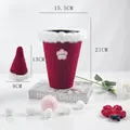 Plush red flower packaging bucket with white fur trim and matching mini hat accessory - Burgundy