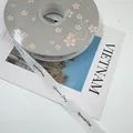 Elegant white grosgrain ribbon with Special Day black text print for gift packaging. - Special Day / 1.5cm x 50 Yards / White