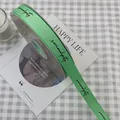 Green grosgrain ribbon with black serendipity print for gift and flower wrapping - Serendipity / 1.5cm x 50 Yards / Light Green