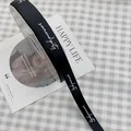 Black grosgrain ribbon with white 'serendipity' cursive text for gift wrapping - Serendipity / 1.5cm x 50 Yards / Black