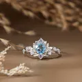 Bague en argent motif feuille vintage avec topaze bleue ronde, vue détaillée du bijou - Argent / Topaze Naturelle