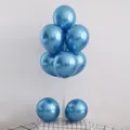 Chrome metallic blue balloons displayed on a transparent table balloon stand - 10" / Metallic Blue