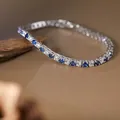 Elegant S925 silver tennis bracelet featuring blue and white round gemstones detail. - Tennis Chain Style / Blue (Natural Sapphire)