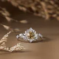 Detailed macro view of a vintage silver ring featuring citrine and leafy branch design - Silver / Natural Citrine