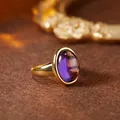 Detailed macro view of natural purple amethyst gemstone ring in gold plated s925 silver - Oval Cabochon Open Ring (R554) / Natural Amethyst (Gold)