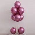 Glossy metallic chrome pink 12-inch latex balloons displayed on a stand for party decor - 10" / Metallic Magenta