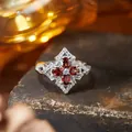 Macro detail of vintage S925 silver ring with red garnet-like stones in clover pattern - Natural Garnet (R565)