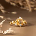 Macro view of vintage gold ring with leaf design and sparkling yellow citrine - Gold / Natural Citrine