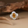 Macro detail of a natural citrine gemstone ring featuring an elegant filigree silver setting - Adjustable / Natural Citrine Ring