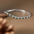 Macro detail of S925 silver tennis bracelet with sparkling green and white gemstones - Tennis Chain Style / Natural Tsavorite Bracelet
