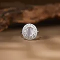 Close-up of vintage s925 silver ring with oval pink gemstone and halo crystals - Natural Rose Quartz Ring