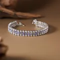 Detailed view of silver caterpillar bracelet with purple tanzanite and clear accent stones - Natural Tanzanite Bracelet