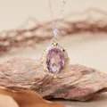 Close-up of vintage oval amethyst pendant necklace with halo of zircon on stone - Natural Amethyst Necklace