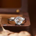 Close-up macro view of a faceted white crystal sterling silver ring on a vintage wooden box - Ring / Natural White Crystal Ring