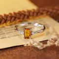 Close-up of an elegant S925 sterling silver ring featuring a rectangular citrine stone - Natural Citrine Silver