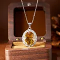 Detail view of a large millennium cut natural citrine pendant in sterling silver - Silver Necklace Pendant (N580) / Natural Citrine Necklace Silver