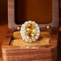 Close-up of a large oval yellow citrine ring with millennium cut in a wooden box - Natural Citrine Ring / Adjustable Open