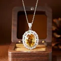 Detailed macro view of a large millennium cut natural yellow citrine pendant in silver - Pendant Necklace / Natural Citrine + Silver