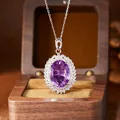Detailed macro view of a large oval purple amethyst pendant necklace in S925 sterling silver - Necklace (Silver) / Purple