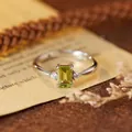 Close-up of elegant S925 silver ring with a rectangular green gemstone detail - Natural Olivine Silver