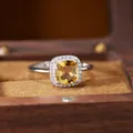 Macro detail of a cushion-cut yellow citrine halo ring resting in a rustic wooden jewelry box - Natural Yellow Crystal Ring (R603)