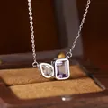 Detail view of S925 silver necklace with pear-cut topaz and rectangular amethyst stone - Natural Amethyst & White Crystal