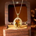Close-up of a stunning millennium-cut yellow citrine pendant necklace in a wooden box - Gold Necklace Pendant (N580) / Natural Citrine Necklace Gold