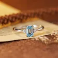 Macro view of a rectangular light blue topaz set in a s925 sterling silver ring - Natural Topaz Silver