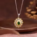 Close-up of elegant emerald sunflower pendant necklace with gold textured setting - Sunflower Style / Natural Diopside Necklace