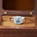 Detailed view of the S925 silver cushion-cut blue gemstone ring in a wooden box - Natural Topaz Ring (R603)